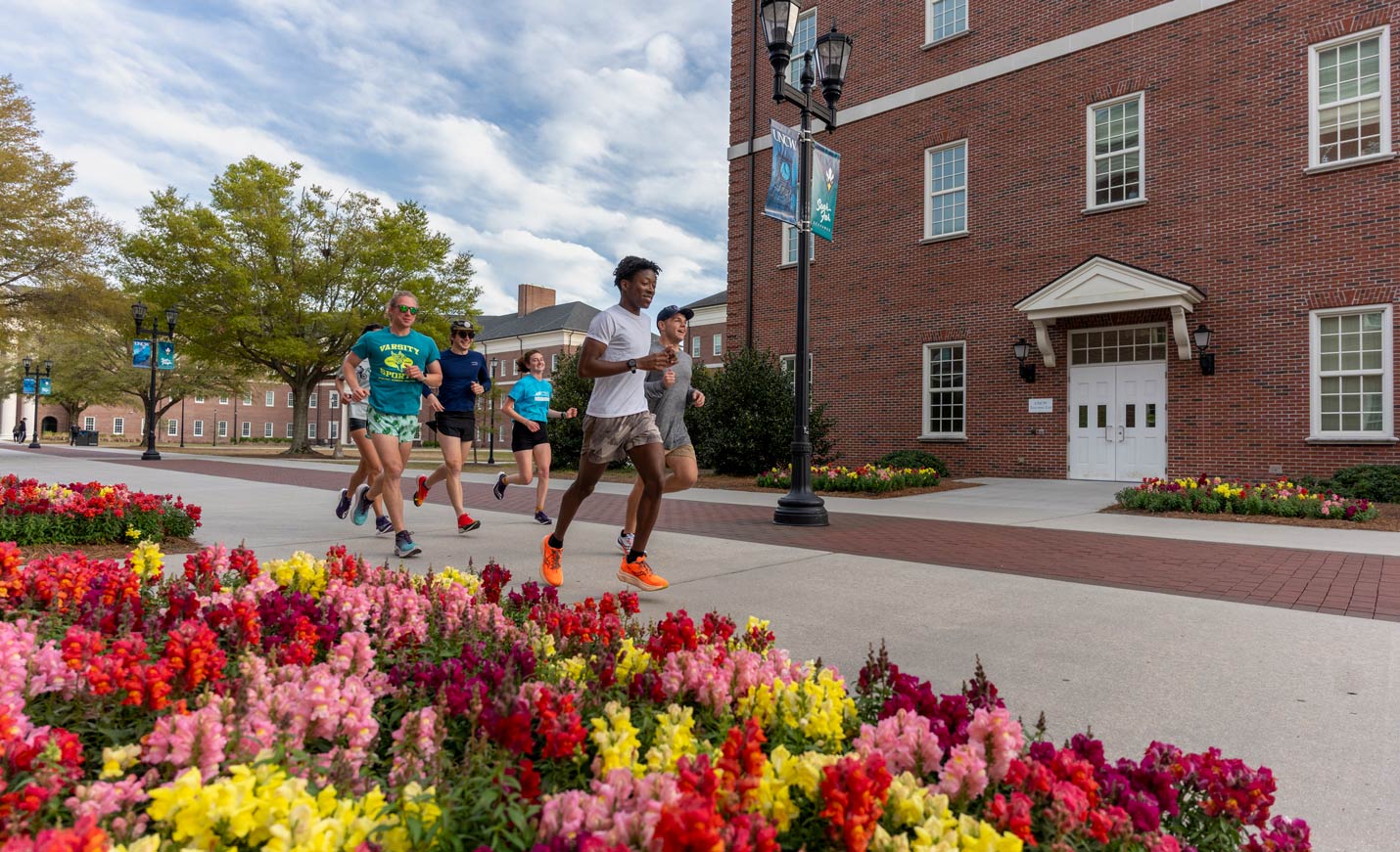 Participants running on chancellors walk